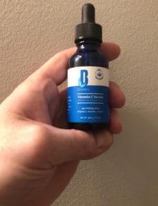 Me holding Dermaboss vitamin c serum
