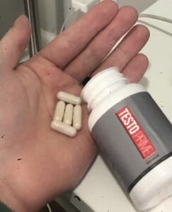 Me holding TestoPrime capsules